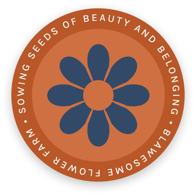 A circular logo with a blue, eight-petal flower in the center on an orange background. Around the edge, white text reads: Sowing Seeds of Beauty and Belonging • Blawesome Flower Farm.