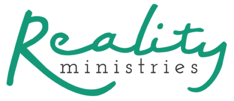 Logo with the word Reality in large, green cursive letters, and the word ministries in smaller, black, lowercase print below it.